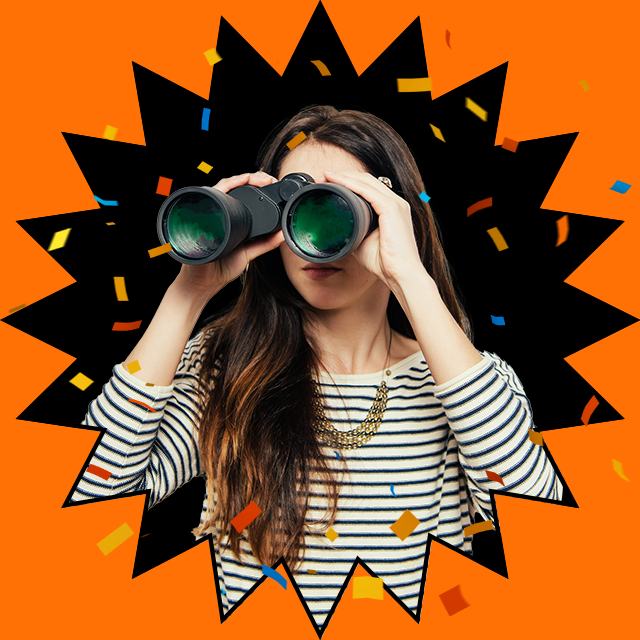 woman looking through binoculars